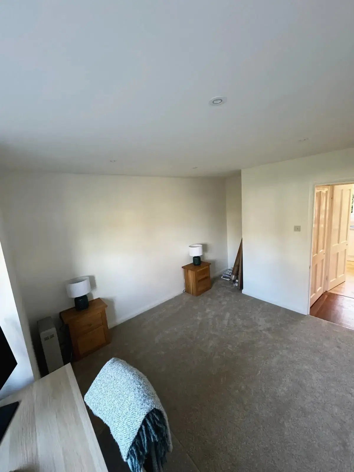 Bedroom refurbishment featuring carpet flooring and updated interiors
