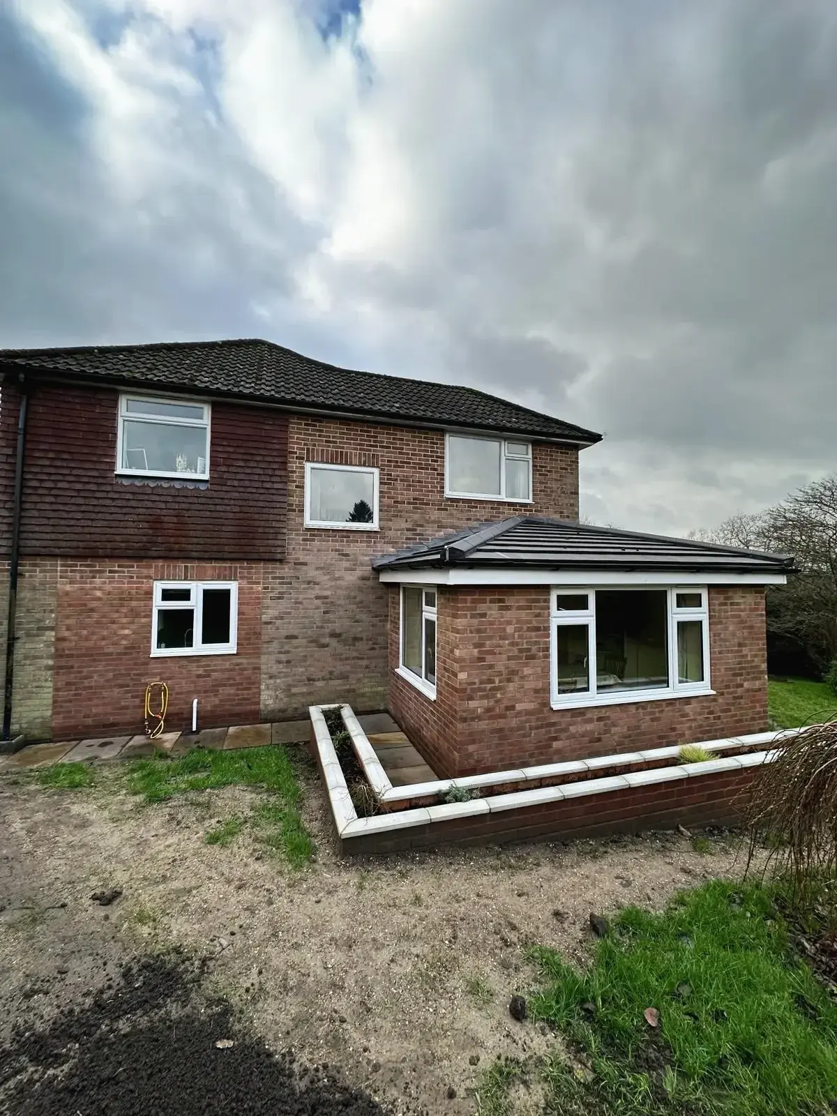 Brick-built home extension adding space and garden features