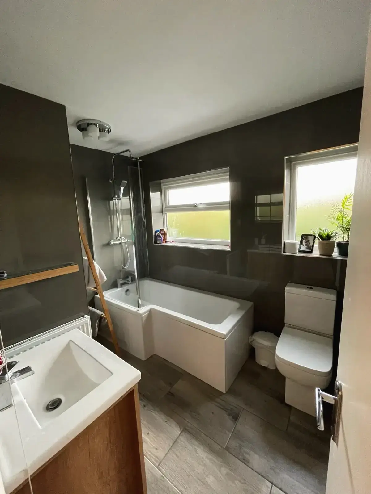 Completed laundry space renovation with washing machine and dryer