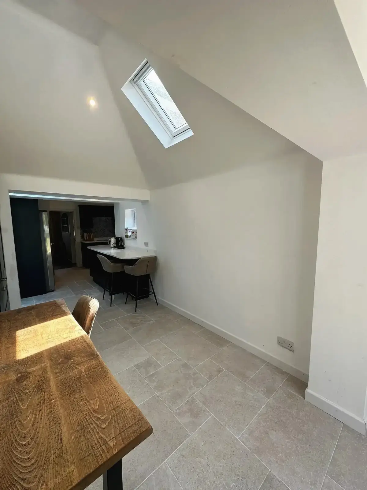 Contemporary dining area with skylight window