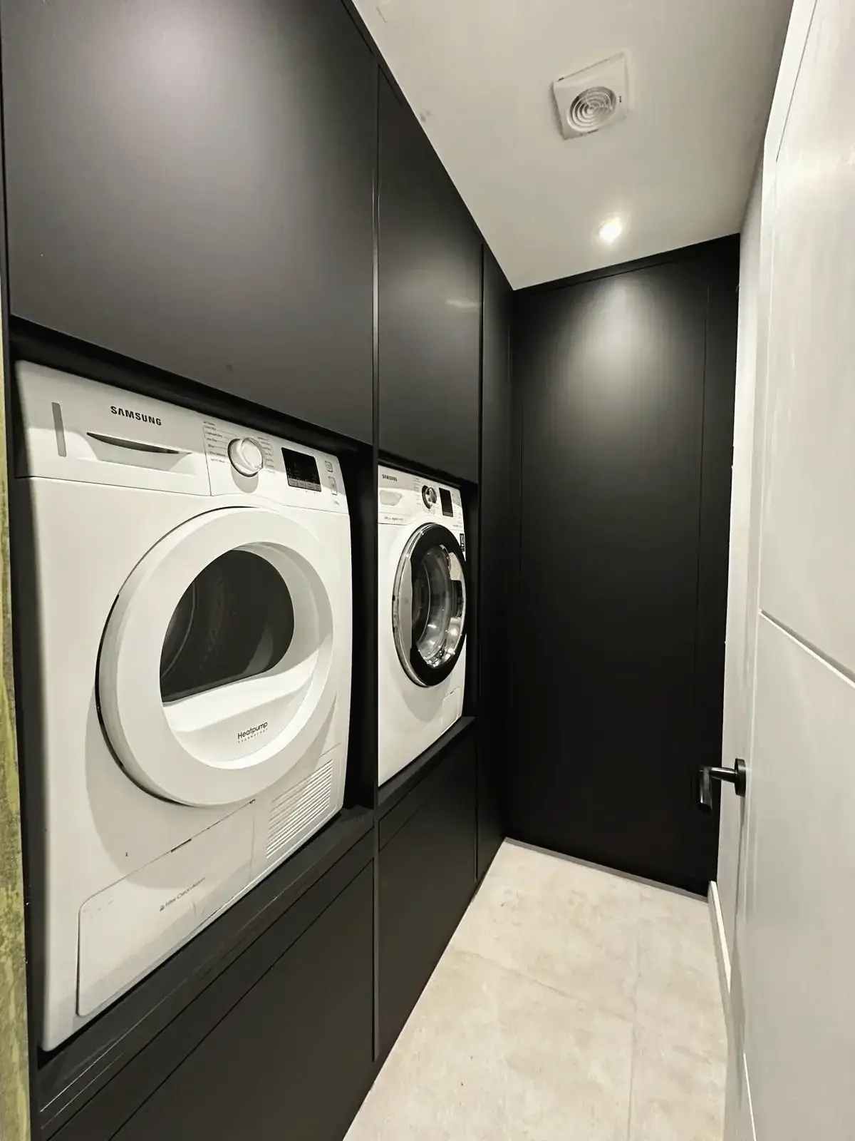 Contemporary laundry area with integrated appliances