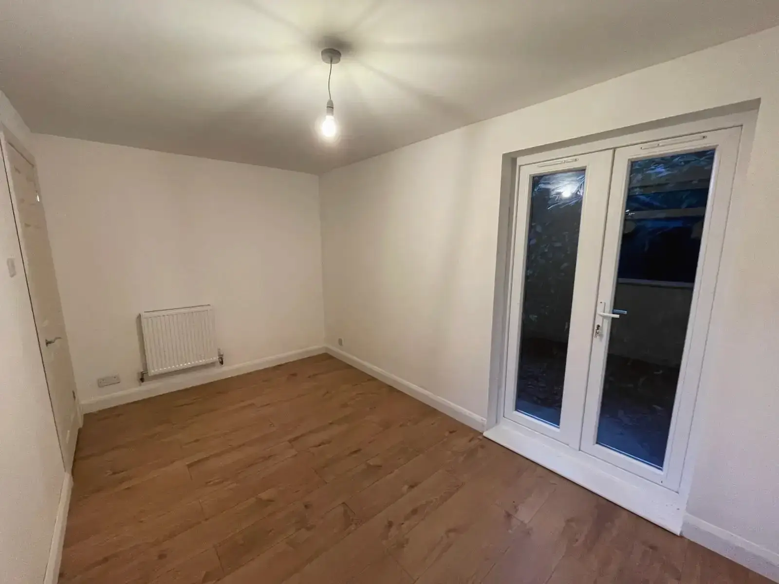 Finished extension interior showing French patio doors