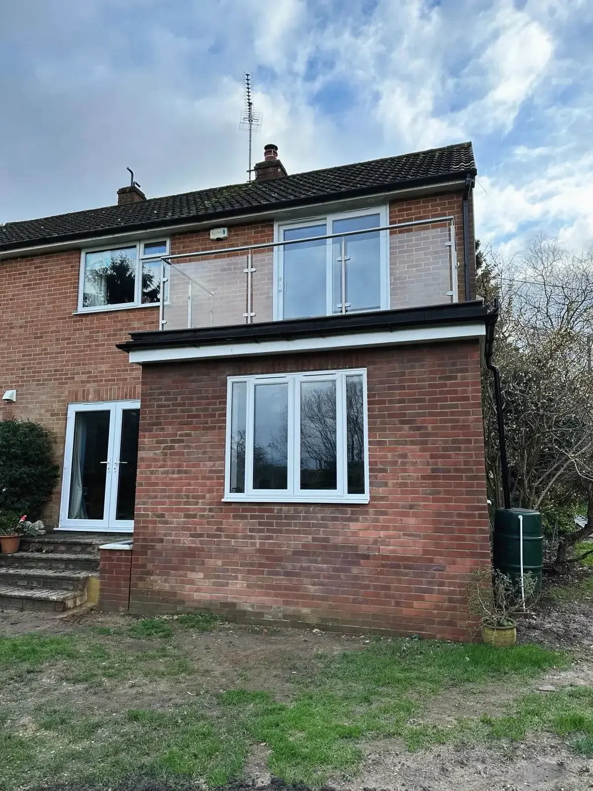 House renovation in Guildford showing brick extension and window installation