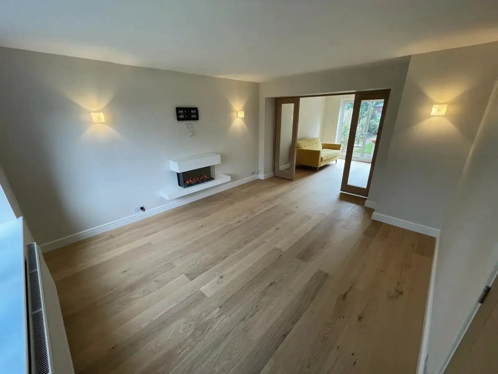 Inside view showing the open main door of the house extension