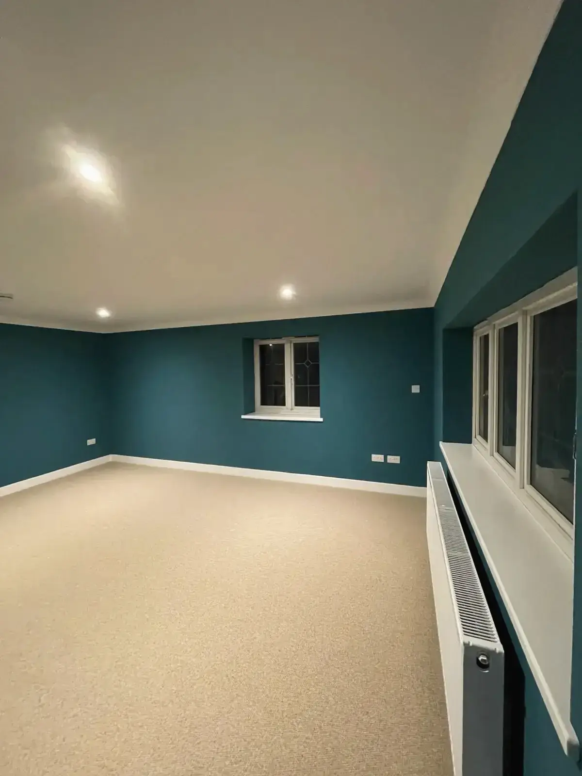 Interior makeover with teal painted walls and bright ceiling