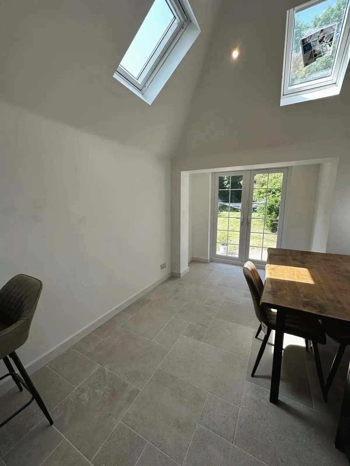 Kitchen extension with dining space and tiled floor