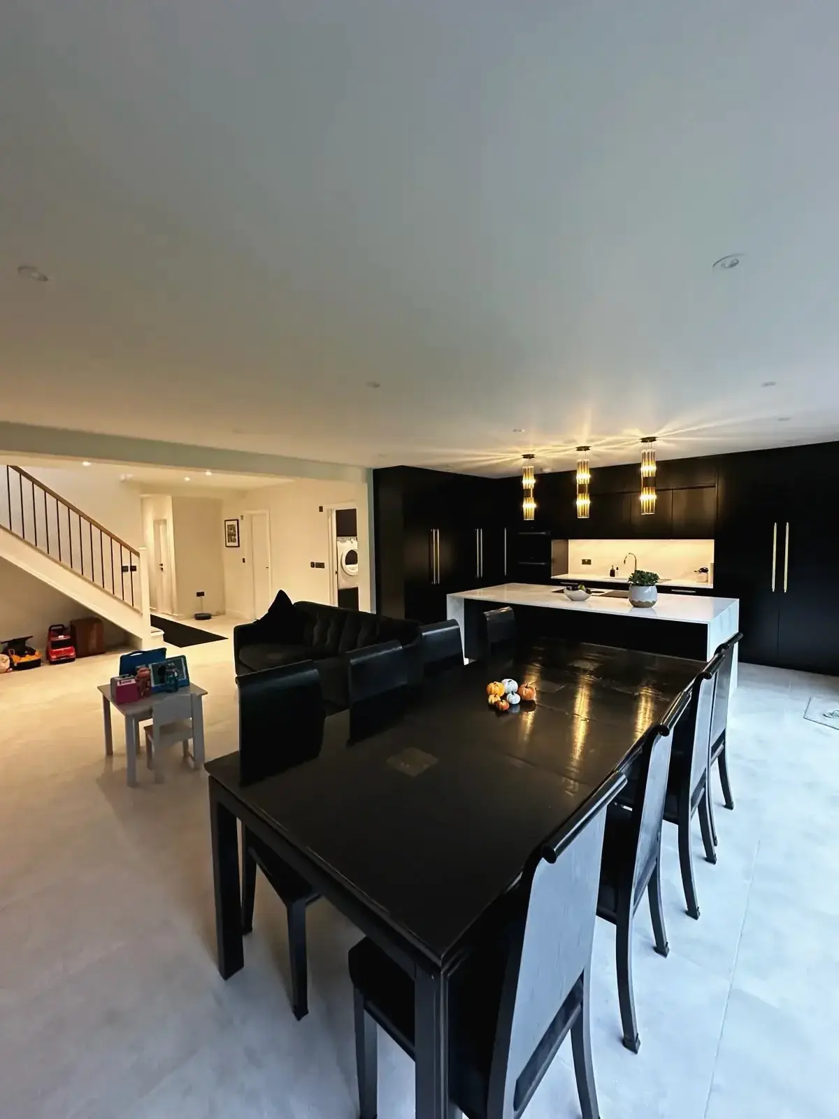 Luxury open-plan dining and kitchen layout with bright lighting