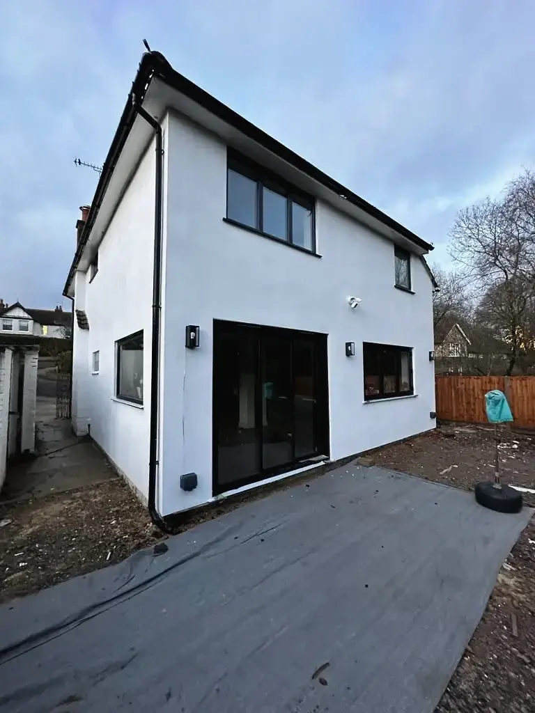Modern two-storey home extension with exterior lighting