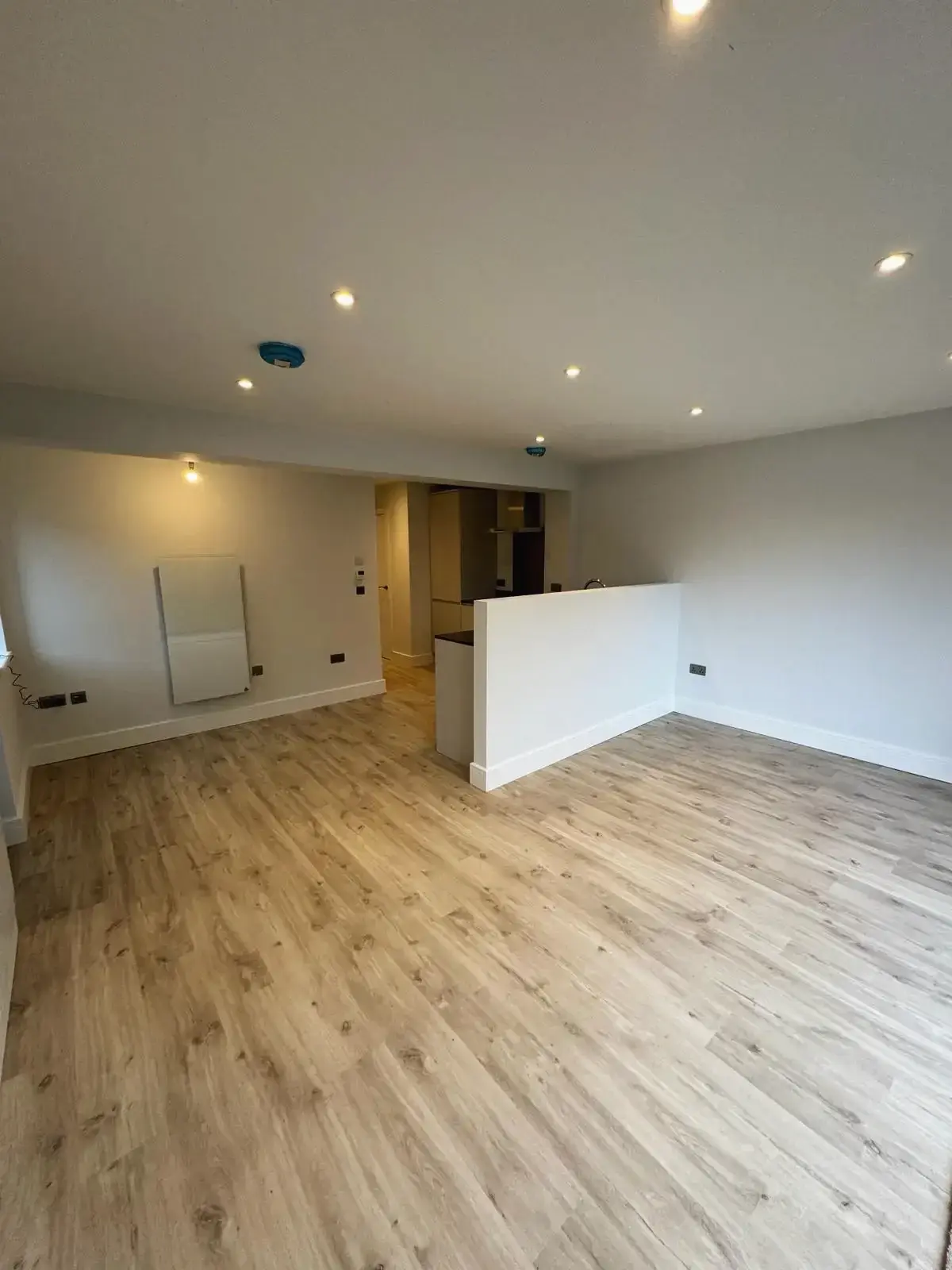 Newly built home interior with spacious living room and kitchen partition