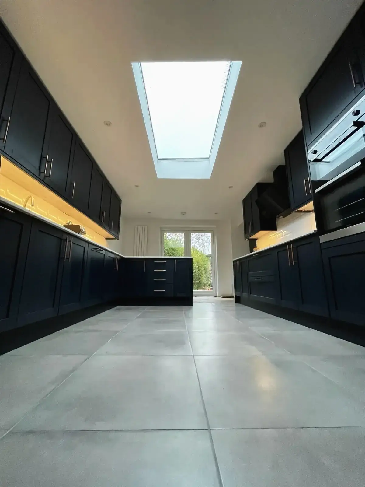 Open plan kitchen renovation with skylight and garden access
