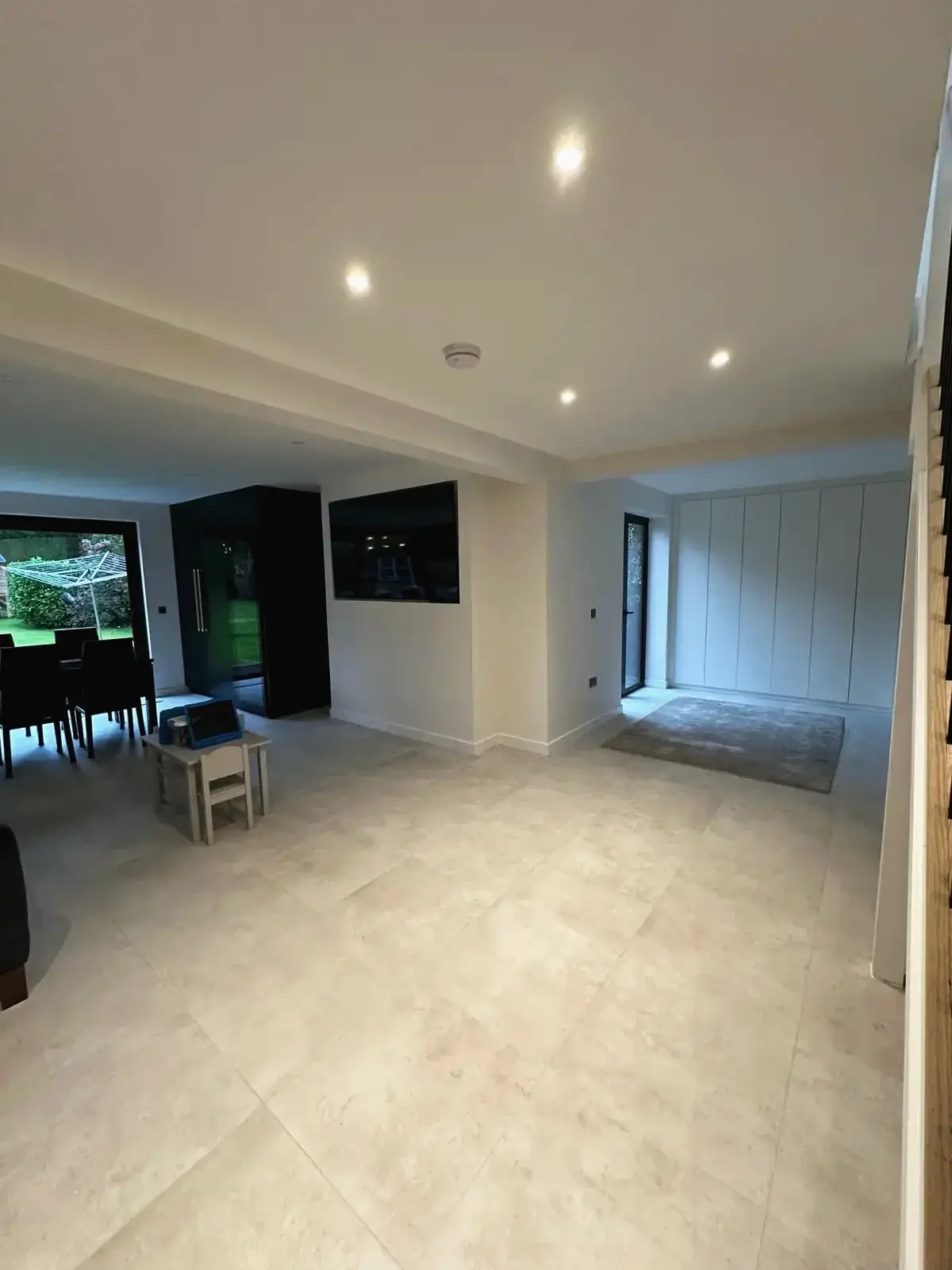 Open plan living area with modern tiled flooring