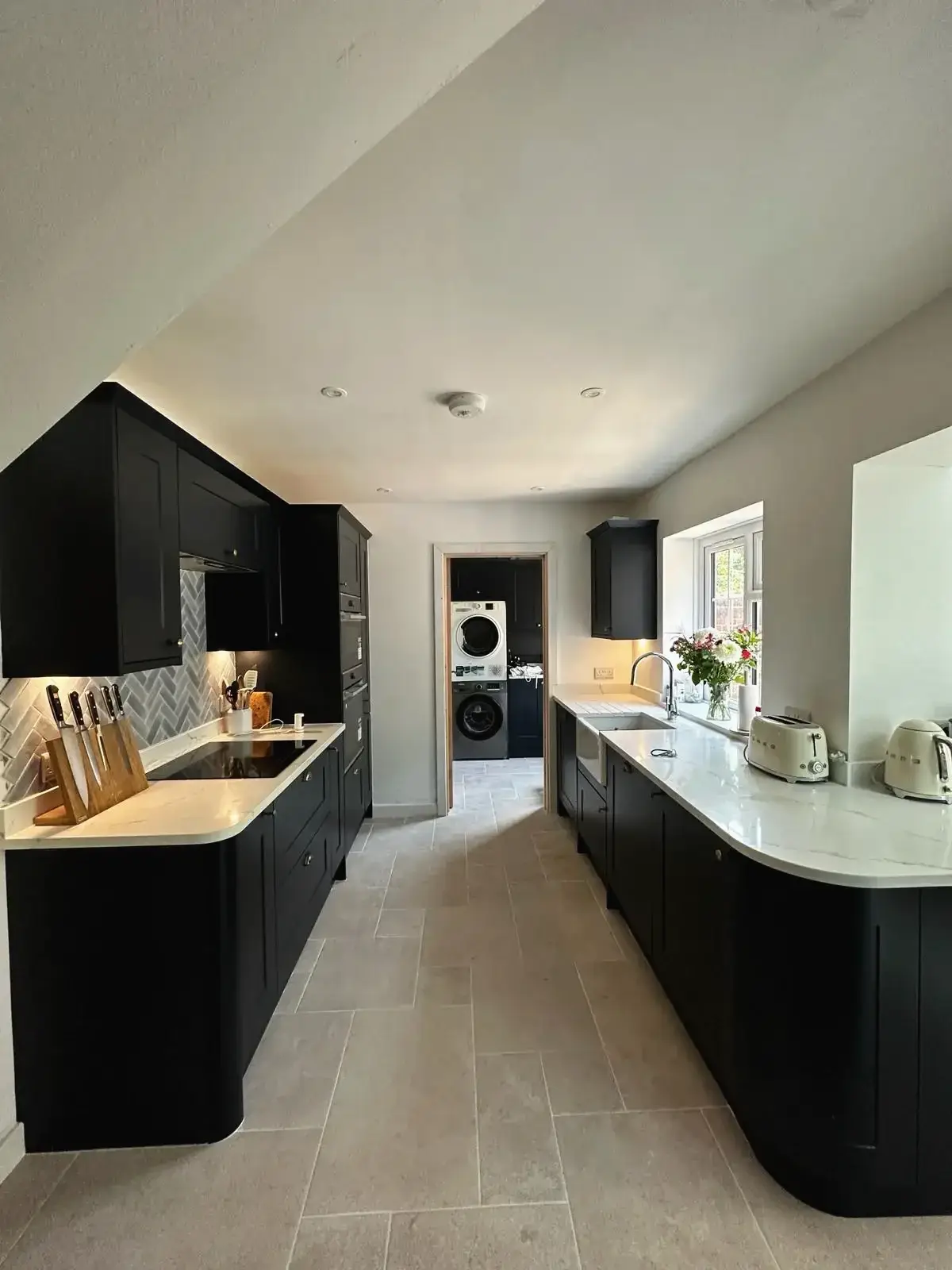 Renovated kitchen interior with breakfast stools and modern finishes