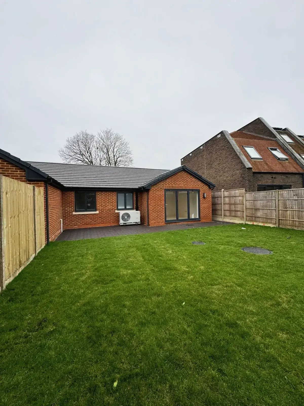 Residential property rear exterior with large garden and outdoor space