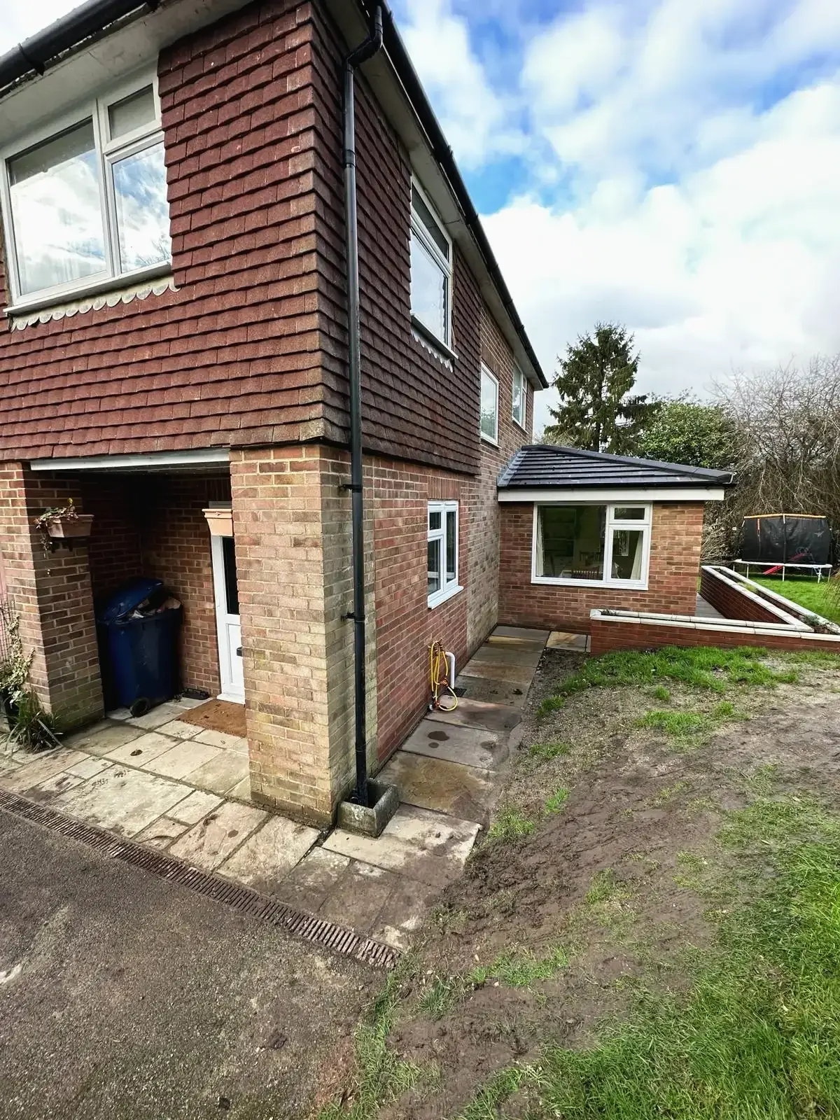 Side view of house extension with new brickwork and roof