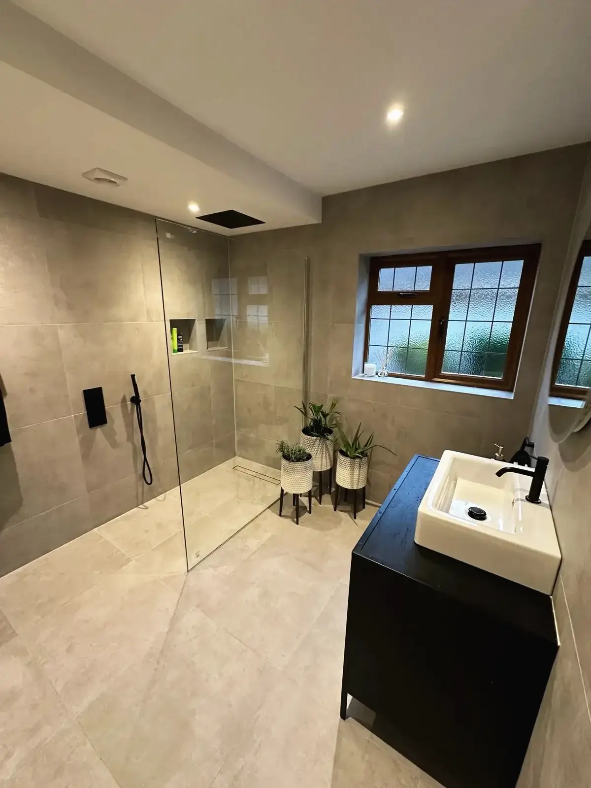 Spacious bathroom with glass shower screen