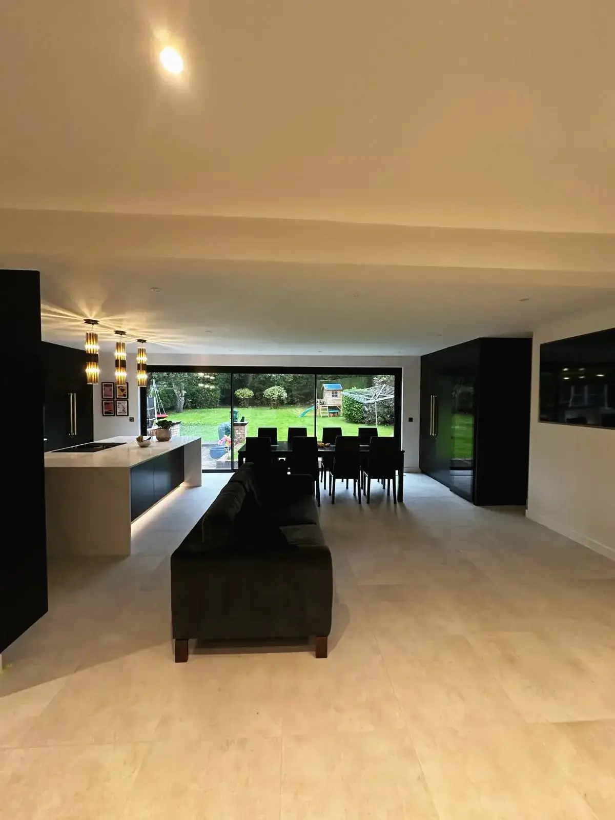 Stylish kitchen-dining layout with outdoor garden view