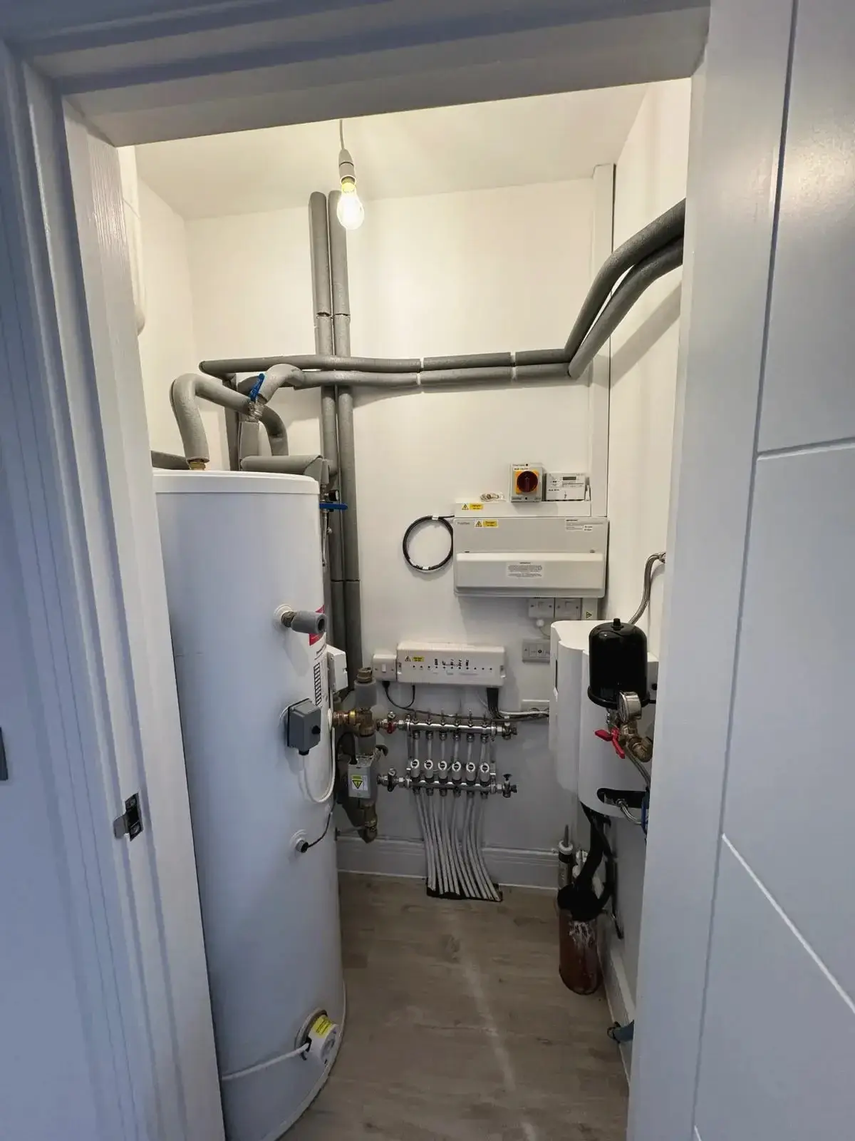 Utility room with boiler and modern heating system installation