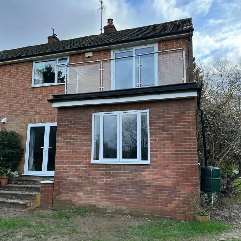 House renovation in Guildford showing brick extension and window installation – Godman Construction