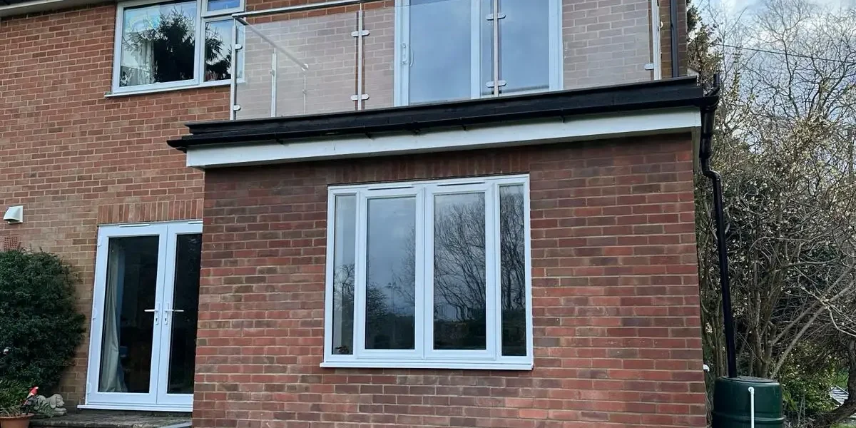House renovation in Guildford showing brick extension and window installation – Godman Construction